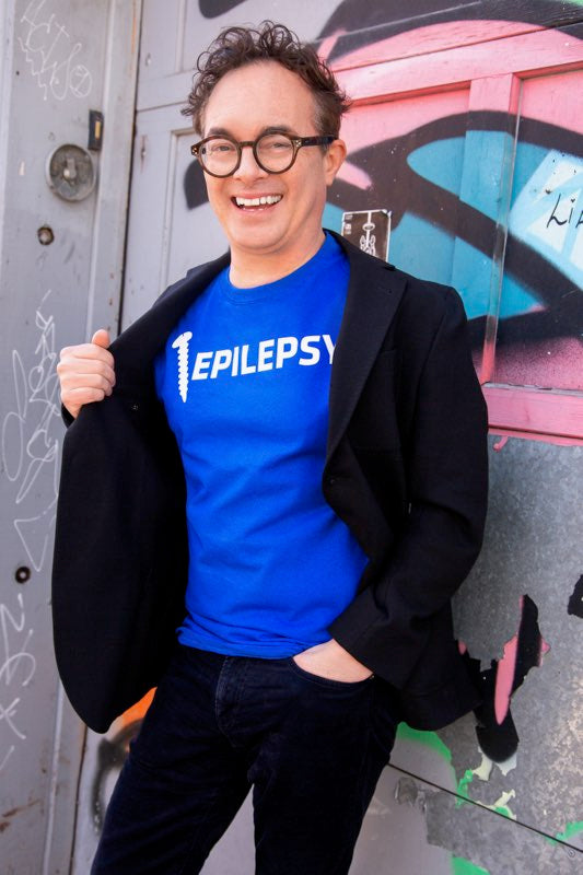 Tommy Smythe wearing our Screw Epilepsy Unisex Shirt