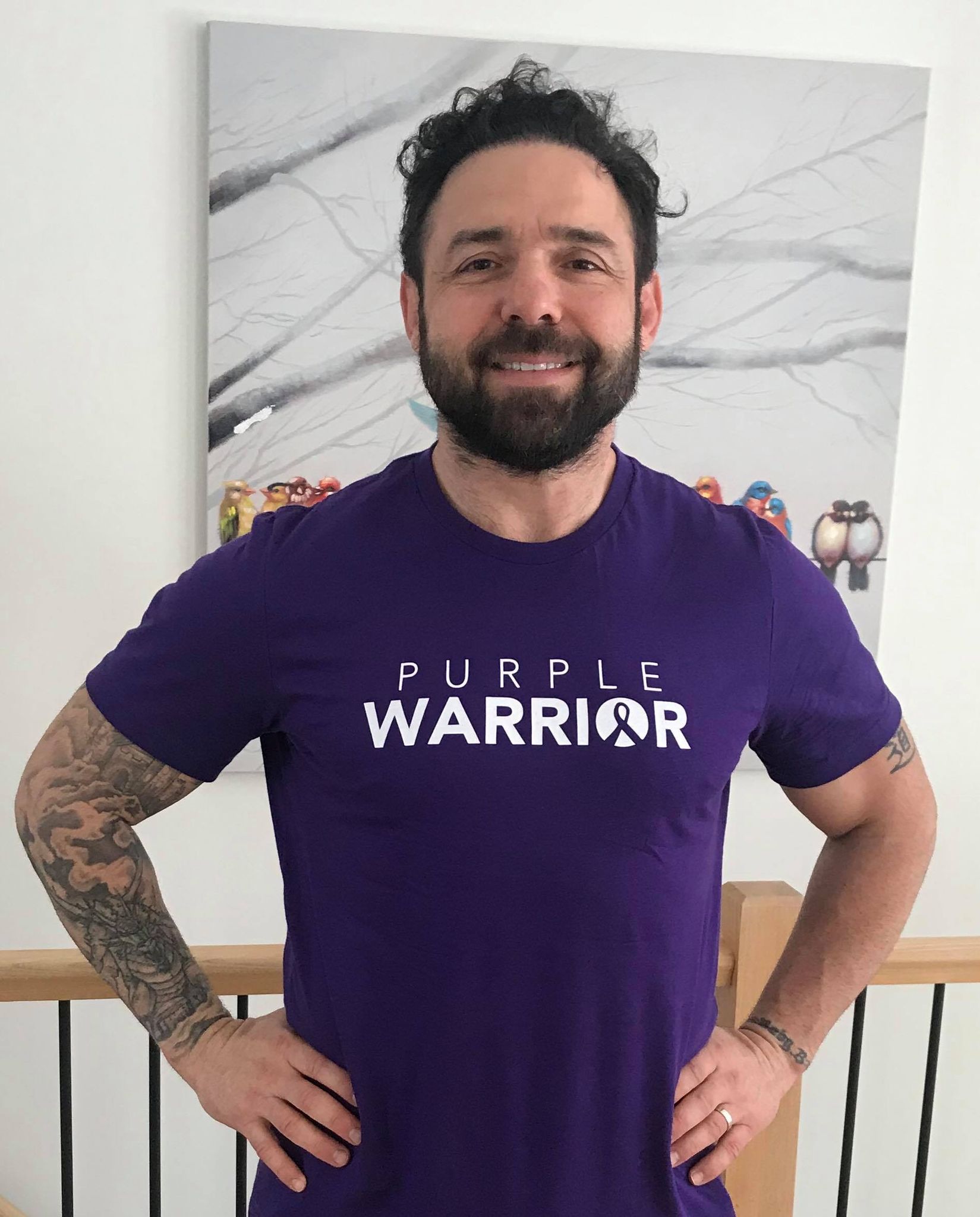 Anthony Carelli wearing our Purple Warrior Unisex Shirt!