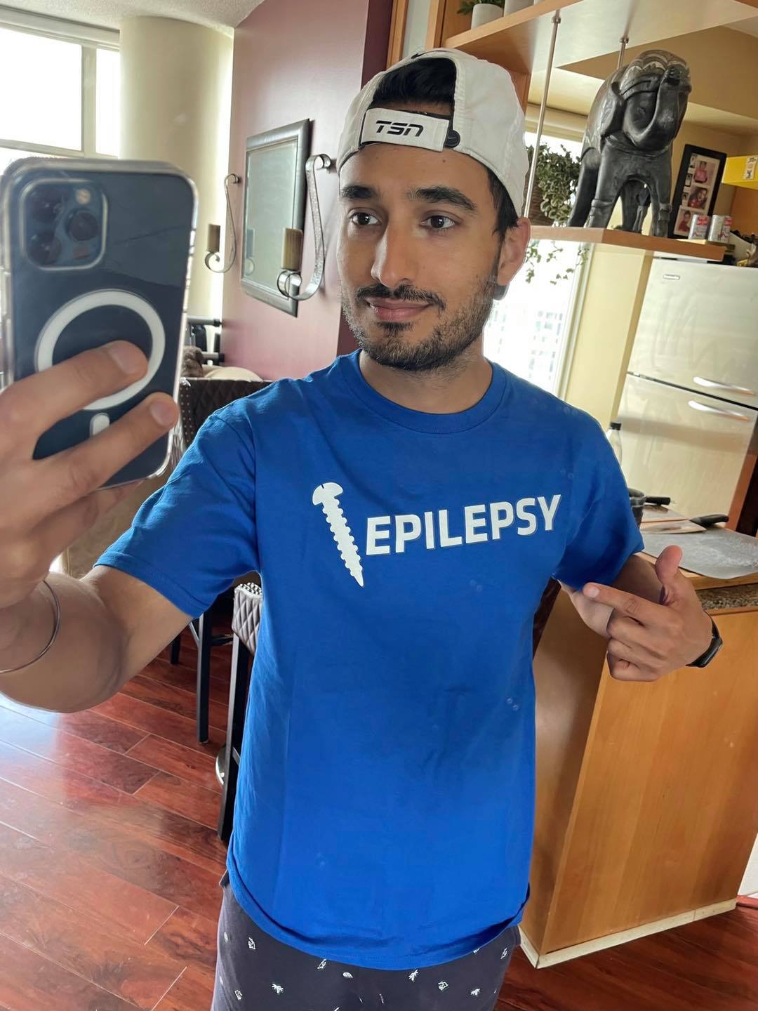 Gurdeep Ahluwalia wearing our Screw Epilepsy Unisex Shirt