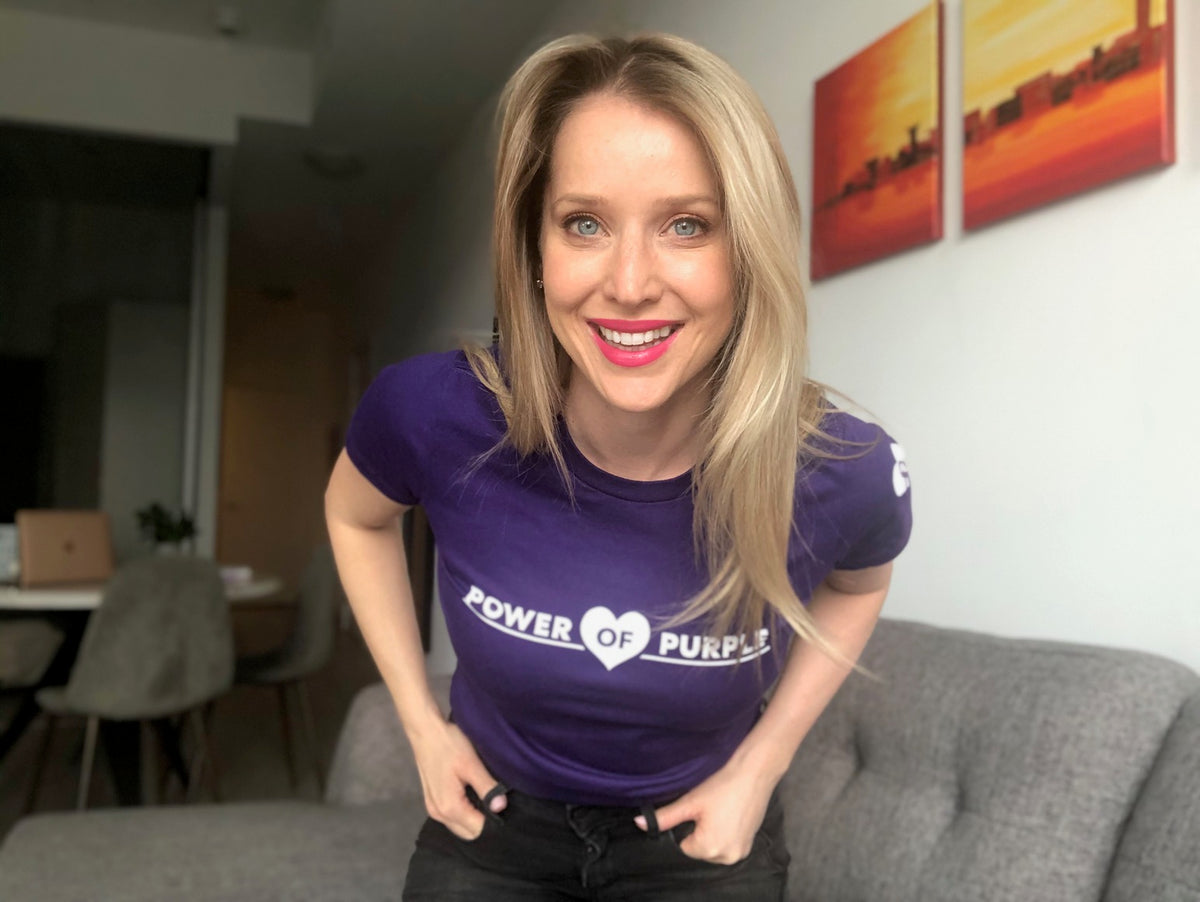 A community member wearing a Power of Purple shirt